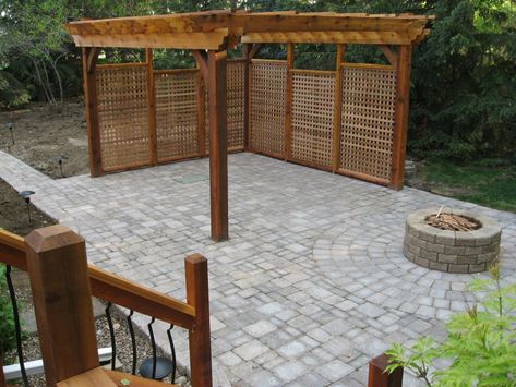 Semi covered patio with fire pit and privacy wall. Patio With Privacy Wall, Fire Pit Privacy, Small Fire Pit Area, Patio With Privacy, In Ground Fire Pit, Fire Pit Wall, Fire Pit Decor, Rocks Landscaping, Small Fire Pit