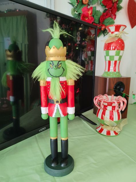 The nutcracker was purchased through Amazon, unfinished. I painted and embellished it. I think it turned out wonderfully. Best of all my grandson loves it. Diy Grinch Nutcracker, Grinch Nutcracker Diy, Elf On The Shelf Nutcracker Ideas, Nutty Crackers, Grinch Nutcracker, Grinch Sleigh, Grinch Stocking, Nutcracker Diy, Christmas Toy Soldiers