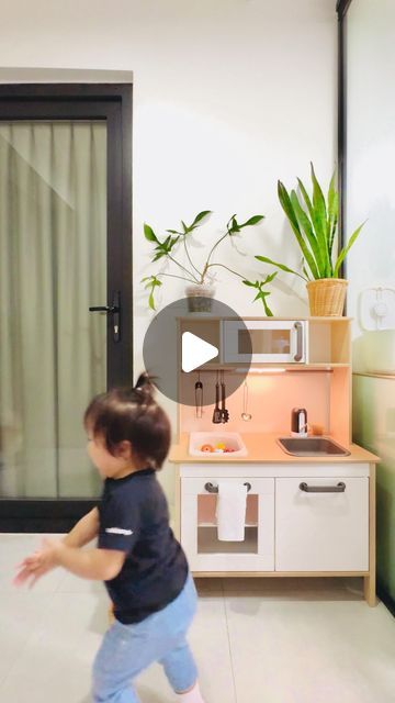 Derrick Hoh 何維健 on Instagram: "Hey everyone! Remember Nori loving her play kitchen? Today’s the #DIY on how I hacked Ikea’s #DUKTIG kitchen for a functional Montessori space!

This wasn’t just pretend play - it’s all about learning & independence! The star feature? A working sink with running water!

Here are the steps:

- We protected the countertop with clear, matte contact paper from Amazon (wood + water = not a good mix!).

- We drilled a hole (or small holes work too!) in the sink and installed a drainage system for a cleaner setup.

- We replaced the pretend faucet with a rechargeable pump and set up two 3-liter containers underneath. Blue for clean water, red catches wastewater.

- Safety first! We secured the containers with a magnetic child lock.

We also got creative with the spa Ikea Play Kitchen Water, Ikea Play Kitchen Montessori, Functional Toddler Kitchen, Montessori Space, Montessori Kitchen, Ikea Play Kitchen, Drainage System, Just Pretend, Toddler Play