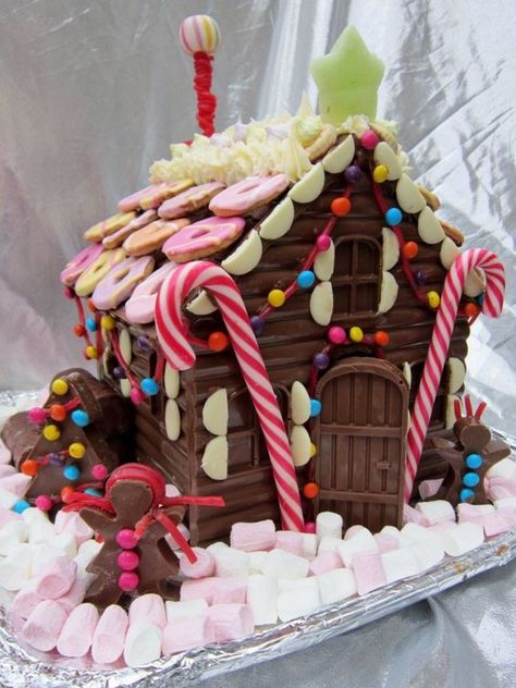 Chocolate bar Gingerbread house decorated with marshmallows and cookies Graham Cracker Gingerbread House, Gingerbread House Ideas, Cool Gingerbread Houses, Gingerbread Dough, Chocolate House, Gingerbread House Designs, All Things Gingerbread, Gingerbread Village, Gingerbread House Decorations