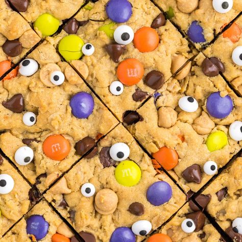 Halloween Monster Cookie Bars Halloween Blondie Bars, Halloween Cookie Bars Recipes, Halloween Cookie Bars, Halloween Blondies, Monster Brownies, Monster Bars, Halloween Bars, Monster Cookie Bars Recipe, Halloween Monster Cookies