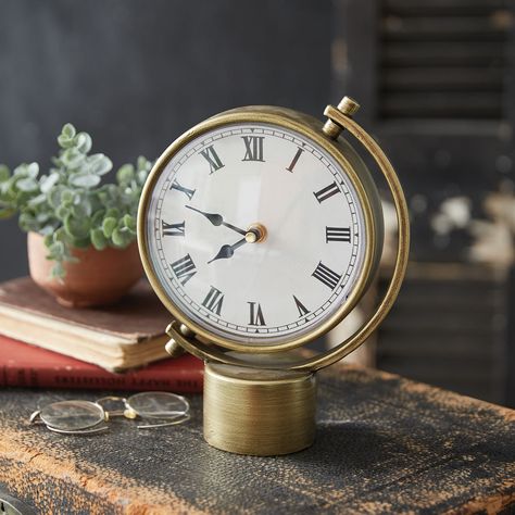 Bring the allure of the mid-century modern era into your home or office with our Atlas Tabletop Clock. Elevate your space with its timeless charm and contemporary appeal. This metal clock requires one AA battery, not included. Measurement: 7''W x 2''D x 9¼''H Geometric Clock, Wall Decor Storage, Decor Baskets, Candle Wall Decor, Shelf Clock, Metal Clock, Table Lamp Wood, Table Clocks, Decor Storage