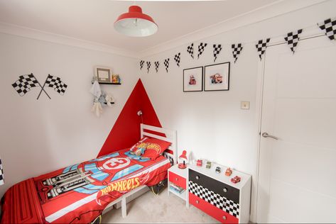 Ive been scouring pinterest for inspo for my little ones bedroom. He is obsessed with hot wheels and Disney Cars so what better than a racing car bedroom! We kept it cheap and cheerful but he loves it so thought I would share for anyone looking for something similar. I spent most of my time looking for a funky chest of drawers that didnt cost the earth. I ended up with a cheap set from Argos which I brightened up with some adhesive wallpaper. Cars Theme Room Boys Disney, Pixar Cars Themed Bedroom, Racing Car Bedroom, Toddler Bedroom Boy Cars, Race Car Room Decor, Car Theme Bedroom, Disney Cars Bedroom Decor, Car Toddler Room, Disney Cars Room