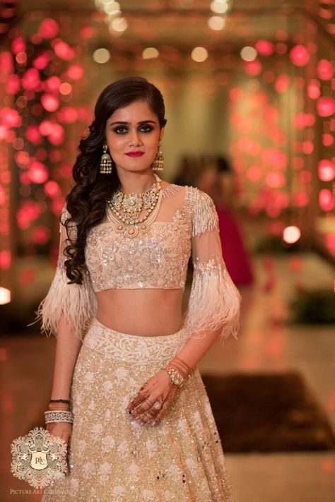 How To Nail Winter Weddings While Looking Fashionable At The Same Time! | WedMeGood Feather Blouse, Lehenga Jewellery, Desi Wear, Pink Lehenga, Unique Blouse, Trendy Blouse Designs, Bridal Look, Feather Dress, Indian Designer Wear