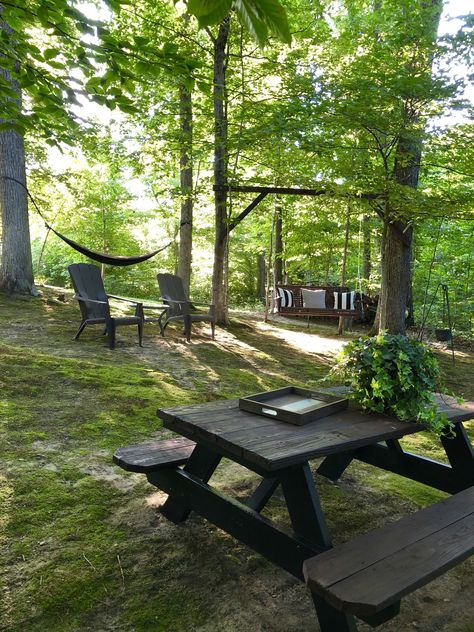 Outdoor Living Space In The Woods, Forest Yard Ideas, Seating Area In Woods, House In Woods Landscaping, Patio In Wooded Area, Backyard Woods Landscaping Yard Ideas, Rural Backyard Landscaping, Backyard Campsite Ideas, Backyard Forest Ideas