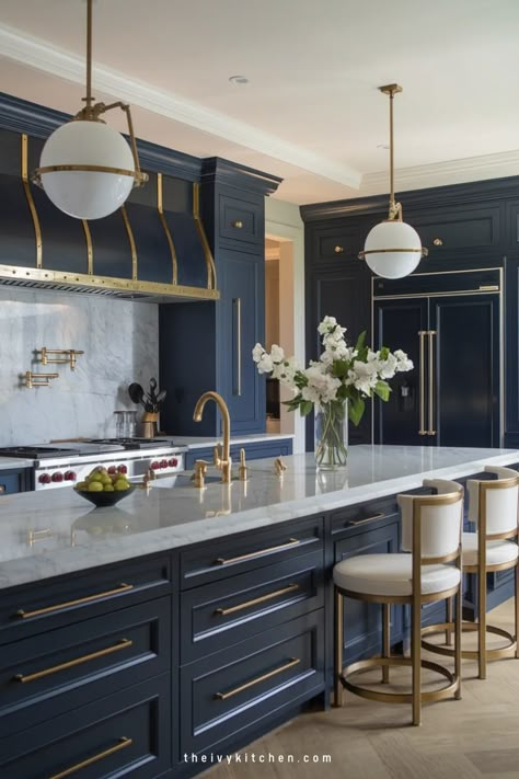 Luxurious kitchen with navy cabinets, gold accents, a marble countertop, and elegant pendant lights. Countertops For Blue Cabinets, Blue Modern Kitchen, Ivy Kitchen, Luxury Kitchen Designs, Modern Luxury Kitchen Design, Florida Kitchen, Unique Cabinet, Modern Luxury Kitchen, Marble Countertops Kitchen