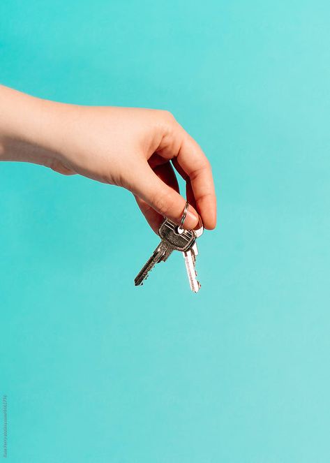 Hands holding keys to a house against a blue backdrop. Merch Shoot, Freedom Graphic, Blue Backdrop, Hand Reference, Hands Holding, Blue Backdrops, Keys Art, Photoshoot Concept, All About Eyes