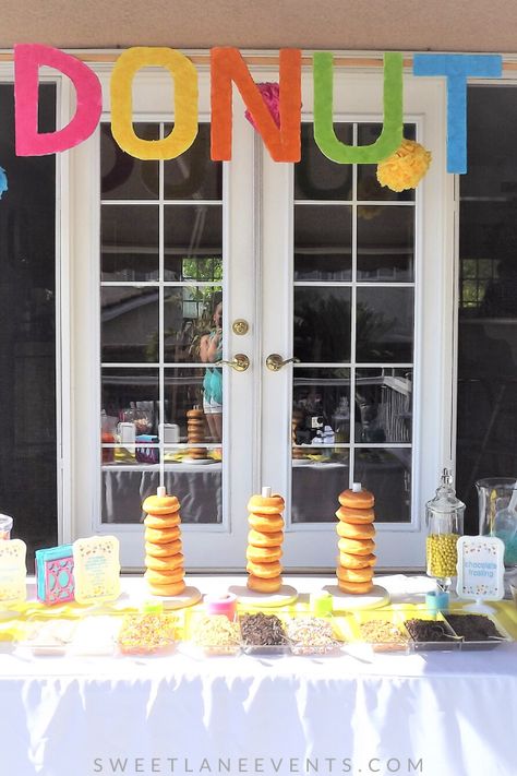 So fun and soooo good.  Let your guests decorate their own donuts with frostings, cereal, sprinkles, candy, chocolate and more.  Great for both kids and adults, anyone with a sweet tooth will love this! #donutbar #donuts #doughnuts SweetLaneEvents.com