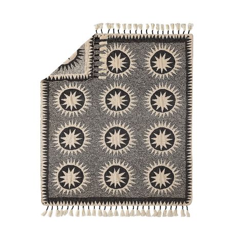 Designed by Justina Blakeney, the Soleil Throw blanket is Justina's modern spin on a traditional suzani quilt. The sun medallions are meant to radiate positive energy. The black dots combined with the suns symbolize the infinite nature of the cosmos. This pattern is featured on a cream background. The look is made complete by rows of tassels that give the modern throw a boho flair. Radiate Positive Energy, Justina Blakeney, Chenille Throw, Blanket Black, Knit Throw Blanket, Plush Throw Blankets, Quilt Designs, Modern Throws, Woven Throw