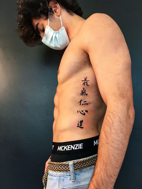 Rib Scar Tattoo, Men Tattoo Ideas Japanese, Japanese Symbol Forearm Tattoo, Asian Stomach Tattoos, Japanese Word Tattoo Men, Japanese Letters Tattoo Men, Japanese Spine Tattoo For Men, Chest Tattoo Men Ideas Simple, Backbone Tattoo For Men