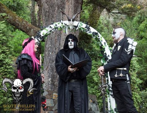 Performing the wedding ceremony under a wedding arch with Goat skull and Black flowers, reading ceremony words from the "Satanic Bible" Halloween 2018, Wellington, New Zealand Satanic Wedding Ceremony, Satanic Wedding, Satanic Bible, The Satanic Bible, Wedding Celebrant, Goat Skull, Wellington New Zealand, Country Weddings, Halloween 2018