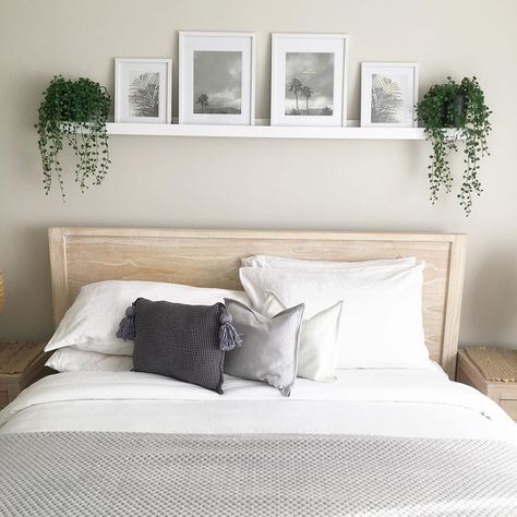 Image from Kmart Hack Queen 👸🏼 on Instagram - I love the picture rail idea above the bed 🥰 Bedroom Decor Above Bed Ideas, Frame Above Bed Ideas, Over Bed Frame Decor, Decor Above Queen Bed, Shelf With Picture Frames Above Bed, Large Pictures Above Bed, Picture Ledge Above Mirror, Diy Shelf Over Bed, Simple Above Bed Decor