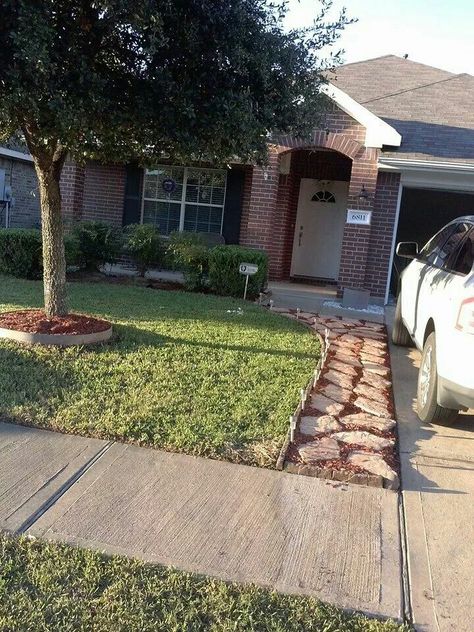 I want to do a rock walk for us next to our driveway like this. A friend of ours did this one and it looks really good. I'm thinking we need the extra walkway space for us. Walkway Beside Driveway, Walking Path Next To Driveway, Pathway Next To Driveway, Flagstone Driveway Extension, Path Next To Driveway, Landscape Pavers Ideas Walkways, Pavers Next To Driveway, Extend Driveway Ideas, Walkway Next To Driveway