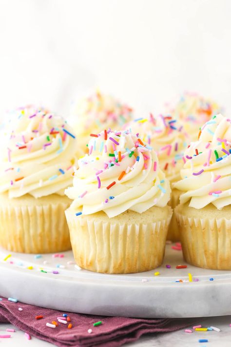 These Vanilla Cupcakes are moist, light & fluffy! If you are looking for a totally foolproof, easy & perfect classic vanilla cupcake recipe this is it! #cupcakes #vanilla #frosting Light Cupcakes Recipe, Vanilla Cupcake Design, Vanilla Cupcake Frosting, White Cupcake Recipe, Cupcake Frosting Recipe, Vanilla Frosting For Cupcakes, White Cupcake Recipes, Homemade Vanilla Frosting, Best Vanilla Cupcake Recipe