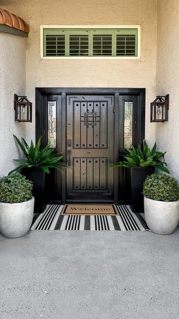 Kimberly Blank on Instagram: "Comment the word OUTDOOR for details to shop this reel sent straight to your dm.

A little front porch redo, with plants that will survive an Arizona summer…best decision!!

Follow me for more affordable home decor @liveloveblank 

#frontporchdecor #frontporch #amazonhome
Amazon home must haves
Front porch decor
Affordable home decor
Desert living" Condo Front Porch Ideas, Southwest Front Porch Ideas, Front Porch Planter Ideas Entrance Flower Pots, Arizona Front Porch Ideas, Home Entrance Decor Outdoor, Front Porch With Plants, Front Porch Potted Plant Ideas, Front Porch Redo, Outdoor Entryway Ideas