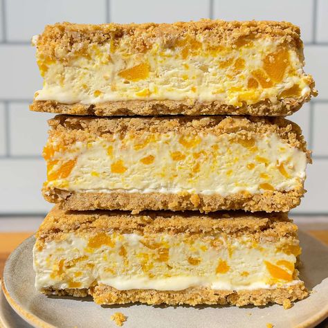 This mango graham ice cream sandwich brings a fresh twist on the classic Filipino Mango Float. This recipe is simple and perfect for summer gatherings, family barbecues, or just a fun treat on a hot day. Mango Graham Bar, Mango Float Filipino Recipe, Mango Graham Ice Cream, Filipino Mango Float, Mango Float Filipino, Graham Bar, Mango Graham Float, Filipino Mango, Sandwich Cafe