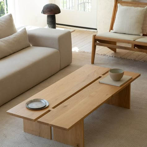 Simple in design, the Kyoto Coffee Table is a pleaser for the striving minimalist. Made from solid white oak wood, a clear matte protective finish is used to allow the unique grain of each piece stand out. The solid wood planks are then joined by two "butterfly joints," made famous by Japanese-American woodworker George Nakashima in the 1950's. The piece is available in 50" x 21" or 60" x 27.5" in natural or a "watercolor" black finish. Wood Coffee Table Minimalist, Bent Wood Coffee Table, Asian Style Coffee Table, Castlery Coffee Table, Diy Oak Coffee Table, Coffee Table Japanese, Japan House Modern Japanese Style Interior Design, Japanese Wood Furniture, White Wood Living Room