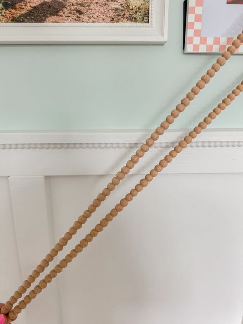 The hottest design trend for 2024, this DIY wood bobbin trim for your board and batten will change the game! It's such a fun and darling addition to your wall paneling and it's perfect for a bedroom, playroom or entryway. You can even add them to dressers and cabinets! Panelling Playroom, Board And Batten Trim, Borden Batten Walls, Fluted Board And Batten, Bead Bored Walls, Girls Bedroom Board And Batten, What Wood To Use For Board And Batten, Scalloped Board And Batten, Brad Board Walls