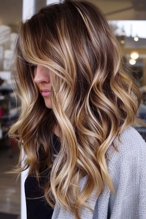 Perfectly imperfect, these balayage beach waves carry the essence of summer throughout the year. The blend of blondes is as refreshing as a gentle sea breeze and just as inviting.
Tap the link for more style inspiration! Brunette With Blonde Highlights Medium Length, Long Layered Beach Waves, Soft Waves Long Hair, Soft Beach Waves, Beachy Highlights, Beachy Wave Medium Length Hair, Summer Balayage, Beachy Waves Brunette, Beachy Waves Long Hair