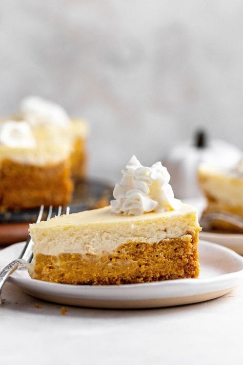 Double-Layer Pumpkin Cheesecake has one layer of creamy pumpkin and one regular cream cheese layer. Perfect for your Thanksgiving dessert! Double Layer Pumpkin Cheesecake, Eggnog Cheesecake Recipe, Holiday Cheesecake Recipes, Berry Pie Filling, Festive Dessert Recipes, Cheesecake Pie Recipes, Layered Pumpkin Cheesecake, Cheesecake Slice, Dinner Then Dessert