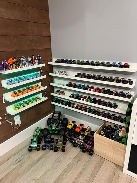 Dinosaur And Car Bedroom, Toy Train Organization, How To Organize Monster Trucks, Monster Truck Garage Diy, Monster Truck Toy Storage Ideas, Monster Truck Organization Boy Rooms, Diy Monster Truck Storage, How To Store Monster Trucks, Monster Truck Wall Storage