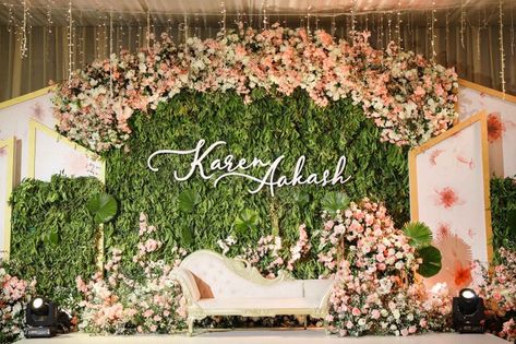 Photo of Beautiful stage decor for reception with a stunning personalised backdrop. Deepika Wedding, Decor For Reception, Pelamin Cantik, Mehndi Event, Engagement Stage, Engagement Stage Decoration, Reception Stage, Reception Stage Decor, Sangeet Ceremony