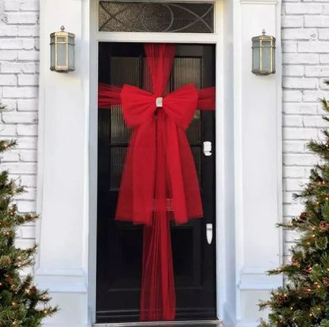 16 Front Door Decorations for Winter Festivities and Fun | Hunker Door Wrapped Like Present, White Front Door, Door Bow, Christmas Door Decoration, Diy Butterfly, White Wreath, Christmas Front Porch, Christmas Front Doors, Holiday Door