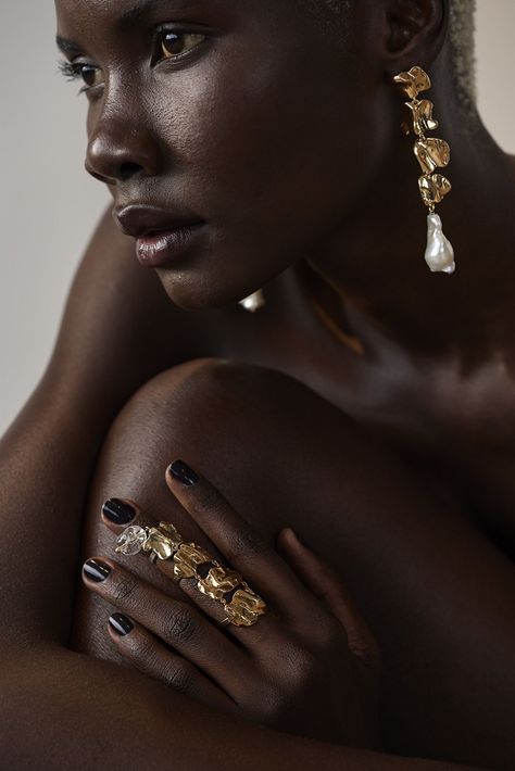 Tucked Back Hair, Jewellery Fashion Shoot, Jewellery Shoot, Jewelry Mood Board, Dark Skin Models, Suede Jewelry, Pearl Drop Earrings Gold, Dark Angels, Perfume Photography