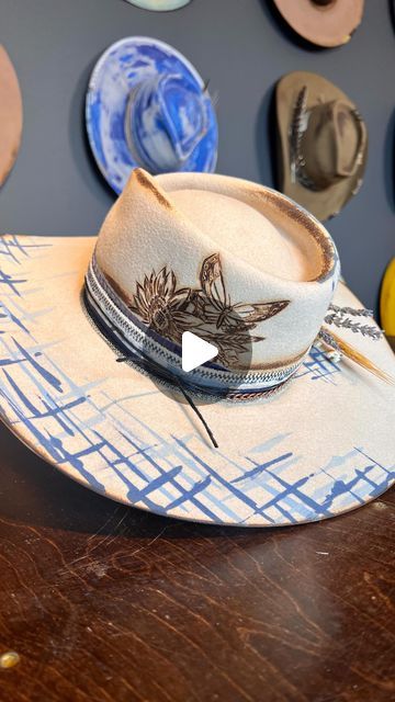 405K views · 16K likes | Alexa Wisnieski on Instagram: "Help me name this one!  *Custom order* . 🦋🌻 Had so much fun working on this custom hat. Incorporating different shades of blue and a very sentimental butterfly. Let’s come up with a name with that in mind!  Drop name suggestions below ⬇️⬇️⬇️ . . #nashville #nasjvilletn #tn #tennessee #art #artist #millinery #milliner #lexlynne #hatmaker #customhat #hatter #creativeprocess #blue #western #westernstyle #weaternfashion #cowboyhat #felthat #paint #countrymusic #newmusic" Diy Burned Felt Hat, Hat Burning Diy, Hat Burning Stencil, Hat Burning, Different Shades Of Blue, Name Suggestions, Instagram Help, Head Gear, Fun At Work