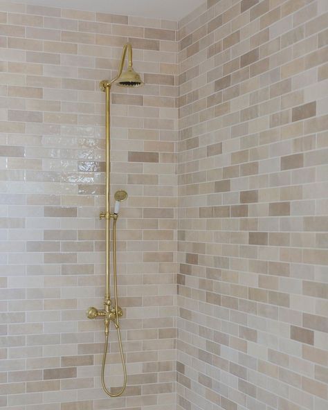 Bedrosians Tile and Stone | Subtle hues bring warmth and dimension to this shower! Shower Tile: Cloe 2.5x8 in Creme Designed by @pyleshomesllc | Instagram Tan Bathroom Shower Tile, Cloe Cream Tile Bathroom, Neutral Bathroom Shower Tile Ideas, Tan Shower Tile, Cream Shower Tile, Master Shower Tile, White Shower Tile, Tan Bathroom, Pink Bathrooms Designs