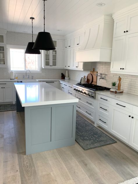 Sherwin Williams High Reflective White, a popular white for cabinets, walls, trims, exteriors and more. Learn about it with Online Paint Colour expert, Kylie M Interiors. Shown here in a kitchen with Magnolia Teak Cups gray on the island, whitewash wood floor, subway tile backsplash and black pendants over the island. Client photo #paintedcabinets #whitepaint #bathroom #diy #updateideas #kitchenisland #bestpaintcolours #kylieminteriors #kyliemedesign #edesign #kitchen #whitekitchen High Reflective White Cabinets, Behr Light Grey Paint Colors, True Grey Paint Color, Behr Paint Colors Grey, High Reflective White, Best Cabinet Paint, Kylie M Interiors, Black Pendants, Best Gray Paint Color