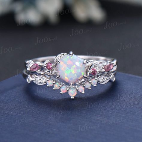 Nature Inspired  Jewelry, Twig Opal Ring Set , 10K Rose Gold, Hexagon Cut Ring, Branch Engagement Ring, Pink Tourmaline , October Birthstone, Birthday Gifts Main Ring : 6*6mm hexagon cut Lab white opal. Side stone : Pink Tourmaline Matching Band: moissanite and opal. Material Metal: 925 sterling silver, Solid 14k/18k gold, platinum PLEASE choose silver or platinum if you are allergic to nickel. This jewelry is made to order, it can be made with any gemstone/metals. 2-3 weeks to finish. Default S Wedding Ring Gemstone, Branch Wedding Ring, Fantasy Jewelry Magic, Opal Wedding Ring Set, Pink Rings, Opal Engagement Ring Rose Gold, Branch Engagement Ring, Pink Opal Ring, Pretty Engagement Rings