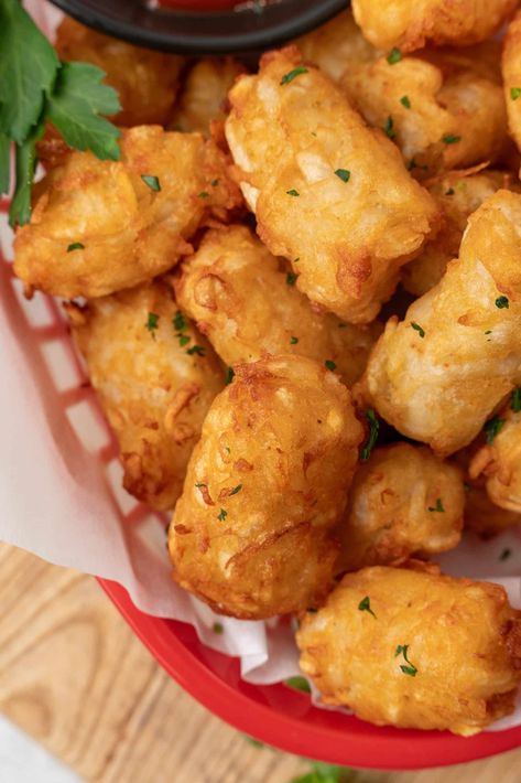 homemade tater tots in a red plastic basket with a cup of ketchup on the side Homemade Tater Tots, Tater Tot Recipes, Tator Tots, Shredded Potatoes, Plastic Basket, Tater Tots, Savory Breakfast, Chicken Nuggets, Hearty Meals