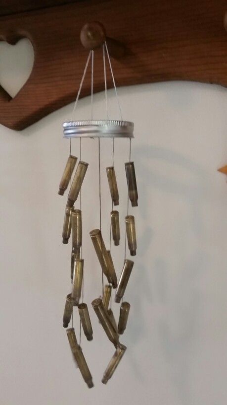 Wind chimes can be so much more than just a pleasant tinkle; it can be a great DIY project for your kids, or to recycle old items in a beautiful way Shell Casings Crafts, Bullet Casing Crafts, Shotgun Shell Crafts, Bullet Casing Jewelry, Bullet Crafts, Bullet Art, Wind Chimes Craft, Bullet Shell, Hunting Decor