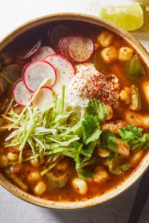 This healthy vegetarian take on the Mexican stew pozole gets tons of flavor from poblano peppers, ancho chile powder and dried herbs and spices, while cannellini beans provide substance, protein and fiber. Chewy hominy—corn that has been treated with lime to remove the tough hull and germ—is integral to the stew. #vegetarian #vegetarianrecipes #vegetarianfood #vegetarianideas #vegetarianmeals #vegetarianinspiration #vegetariancooking #recipe #eatingwell #healthy Hominy Recipes, Posole Recipe, Pozole Recipe, Mexican Stew, Vegetarian Mexican, Poblano Peppers, Slow Cooker Vegetarian, Dried Herbs, Cannellini Beans