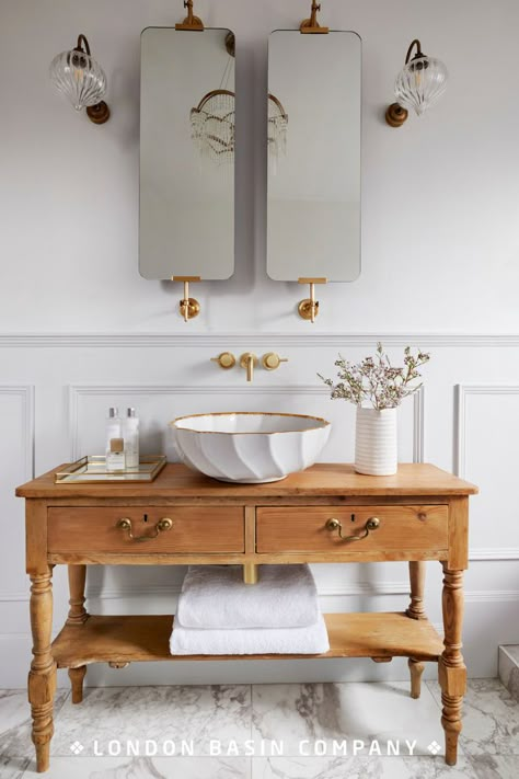 Having taken her cue from a French sideboard she found in an antiques shop, interiors blogger Phoebe Miller sought the perfect basin to sit on top. The delicate design of the Angelica basin tied in beautifully with the bath and light fittings to transform the bathroom into a tranquil oasis. Read our blog for design inspiration. Side Table Bathroom Vanity, Italian Toilet Design, Bathroom Basins Ideas, Turn Of The Century Bathroom, Sink Ideas Bathroom, French Bathroom Decor Vintage, Parisian Style Bathroom, Italian Bathrooms, Powder Room Vanity Ideas