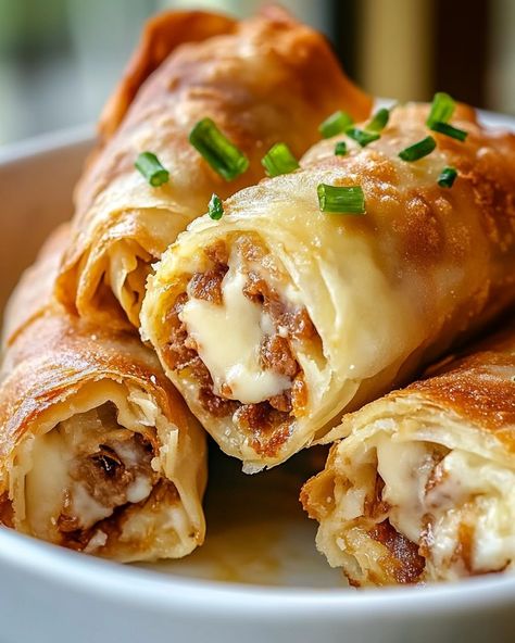 🍴 WOULD YOU EAT THESE SCRUMPTIOUS Reuben Egg Rolls 🍴 📢 "A Crunchy Twist on a Classic Deli Favorite - Perfect for Your Next Family Gathering or Game Day!" 🍽️ Ingredients 🍽️ - 10 egg roll wrappers - 1/2 cup Russian or Thousand Island dressing - 1 cup Swiss cheese, shredded - 1 cup corned beef, chopped - 1 cup sauerkraut, drained and squeezed dry - Vegetable oil, for frying 🧑‍🍳 Directions 🧑‍🍳 1. Start by preparing the filling. In a bowl, mix together the corned beef, sauerkraut, Swiss cheese,... Philly Cheese Steak Egg Rolls Recipes, Philly Steak And Cheese Egg Rolls, Steak Cheese Egg Rolls, Cheese Steak Egg Rolls Recipes, Pork Roll Egg And Cheese, Reuben Egg Rolls, Picky Bits, Thousand Island, Thousand Island Dressing