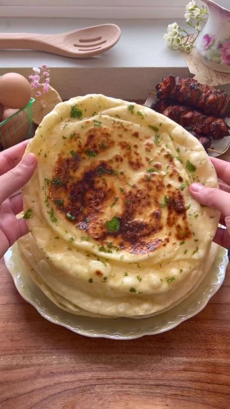 Fluffiest Homemade Garlic Naan ⏲🎞💐 Full recipe & instructions are on the blog, Mxriyum.comWhat you’ll need: Yeast mixture:- 1 cup Warm water- 1 tbsp Active dry yeast- 1/2 tbsp SugarRest of the ingredients:- 4 cups All purpose flour- 2 tsp Kosher salt- 3/4 tsp Baking soda- 3/4 tsp Baking Powder- 3/4 cup Plain Yogurt- 1/4 cup Olive oilOptional ingredients to add to your dough:- 6-10 Garlic cloves minced- Handful freshly chopped cilantroGarlic Ghee topping:- 1/2 cup High quality Ghee, meltedCompr Homemade Garlic Naan, Garlic Naan, Vegetarian Fast Food, Indian Cooking Recipes, Tasty Recipes Videos, Quick Recipes Snacks, Healthy Homemade Recipes, Delicious Snacks Recipes, Food Recepie