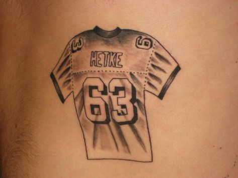 Jersey Tattoo Idea  WGMBWMAGT WGJBWMAGT Football Jersey Tattoo, Jersey Number Tattoo, Jersey Tattoo Ideas, Jersey Tattoo, Number Tattoos, Sports Jersey Design, Tattoo Design Book, Small Tattoos For Guys, Leg Tattoo