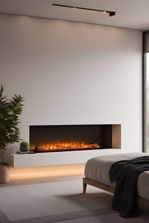 Bedroom with a cozy electric fireplace, stylishly integrated into decor, perfect for both small and guest rooms. Bedroom Fireplace Electric, Electric Fireplace In Bedroom, Modern Electric Fireplace Ideas, Bedroom Primary, Electric Fireplace Bedroom, Electric Fireplace Ideas, Fireplace Options, Fireplace Bedroom, Electric Fireplace With Mantel