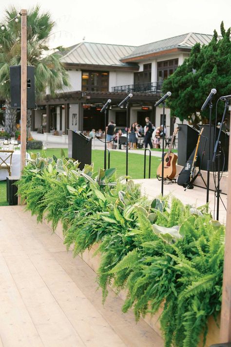 Tropical Greenery at Band Stage    Photography: Bryan Miller Photography   Read More:  http://www.insideweddings.com/weddings/church-ceremony-tropical-outdoor-reception-in-san-diego/1192/ Candle Backdrop, Band Stage, Tall Floral Arrangements, Fern Wedding, Planning Events, Outdoor Stage, Tropical Greenery, Wedding Reception Flowers, Event Stage