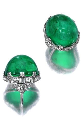 An emerald and diamond ring centering an oval emerald cabochon, measuring approximately 23.3 x 20.5 x 16.55mm., within a baguette and single-cut diamond surround; emerald weighs approximately: 22.00 carats; mounted in platinum; size 4 1/4 (with sizer) Emerald And Diamond Earrings, Bijoux Art Deco, Emerald Cabochon, Emerald And Diamond Ring, Wedding Day Jewelry, Emerald Rings, David Webb, Jewelry Auction, Cabochon Ring