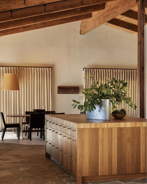 We crafted this kitchen with a combination of wood, plaster, and flagstone. The island is fully programmed so that all utilitarian items can be thoughtfully hidden. The dining room holds a Guillerme et Chambron table, Piet Boon chairs and an Enrico Franzolini floor lamp. Thank you to @archdigestpolska for the beautiful article on one of our favorite homes. (Link in our story!) Interior Design: @corinnemathernstudio Photography: @nicole_franzen Media: @karinemonie Client: @koehlerwinery Flagstone Interior, Nicole Franzen, The Dining Room, Interior Floor, Our Story, Custom Furniture, Floor Lamp, Kitchen Dining, Dining Room