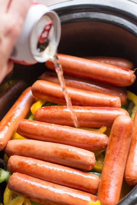 Make these gameday beer brats right in your slow cooker! These are flavored with beer, onions and bell peppers. - The Magical Slow Cooker Magical Slow Cooker, Bratwurst Recipes, Beer Brats, The Magical Slow Cooker, Hot Dog Recipes, Tailgate Food, Crockpot Dishes, Crock Pot Slow Cooker, Crockpot Recipes Slow Cooker