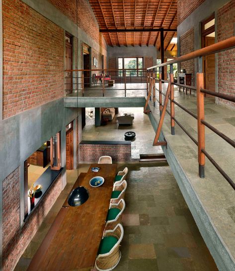 Brick-lined interiors open up to garden filled with fruit trees at Mango House House Architecture Styles, Studios Architecture, Tropical House, Tables And Chairs, Loft Design, Good House, Industrial House, House Architecture Design, Exposed Brick