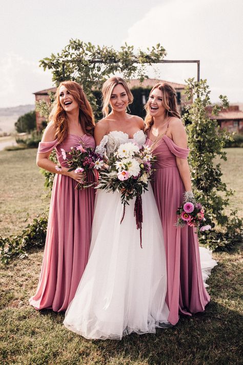 Bride in Structured Bustier Rue de Seine Fox Gown with Floral Appliqué Detail and Off The Shoulder Straps | Pronovias Chiffon Overskirt | Pink, Purple and White Wildflower Bouquet with White Trailing Ribbon | Bridesmaids in Dusky Pink ASOS Dresses with Ruched Bodice and Off-Shoulder Straps | Wooden Wedding Arch with Botanicals | Il Rigo Agriturismo | Rue de Seine Wedding Dress with Pronovias Overskirt, Personalised Place Setting Illustrations and Sweetheart Table | Samuel Docker Photography Dusky Pink Bridesmaid Dresses, Dusky Pink Bridesmaids, Dusky Pink Dress, Rue De Seine Wedding Dress, Dusty Pink Bridesmaid Dresses, Blush Pink Bridesmaid Dresses, Indian Bridesmaid Dresses, Advice For Bride, Pink Bridesmaid Dress