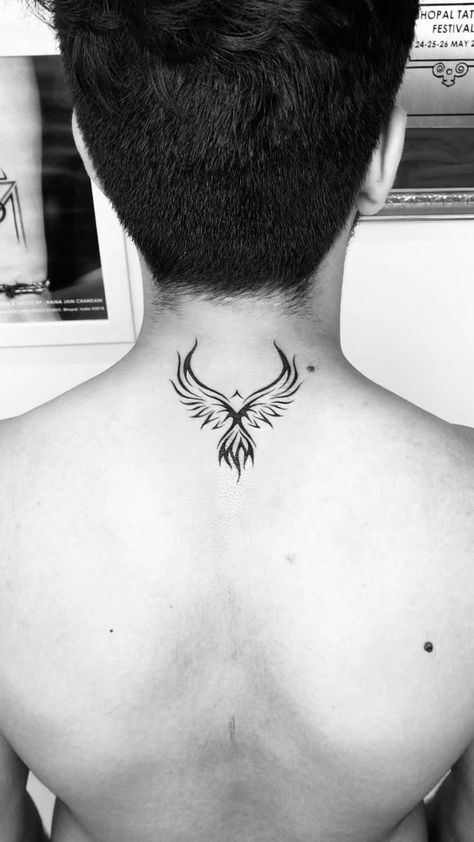 If you're looking for a unique and memorable way to show your support for your favorite team, a back tattoo is the perfect way to do it. From sports logos to traditional images of birds and flowers, there's a back tattoo design that's perfect for you. Back Of Neck Tattoo Men, Phoenix Tattoo Men, Arm Women, 待ち受け おしゃれ, Phoenix Tattoo For Men, Small Phoenix Tattoos, Phoenix Bird Tattoos, Small Back Tattoos, Best Neck Tattoos