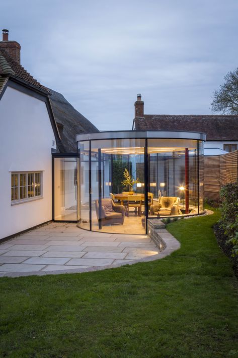 Works included the extension, remodelling and part refurbishment of this Grade II listed cottage. The cottage was extended seamlessly to the front of the property, where the build matched a 20c two storey addition. This was balanced with a striking contemporary glass room and adjoining glass bridge to the rear, attached the original 18c thatched section. The project was designed by client and architect 'Brian Tracey'. The StuartBarr CDR team were supported with internal cabinetry by BarrJoinery. Cottage Extension, Garden Room Extensions, Room Extensions, Sunroom Designs, Glass Extension, House Extension Design, Glass Room, House Extensions, Dream House Exterior