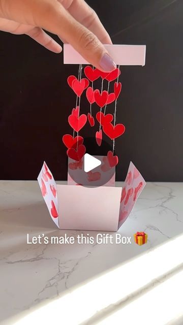 HANDMADE items | crafting girl on Instagram: "Let’s make this Gift Box 🎁 #papercrafts #papercrafting #giftideas #handmadegifts #crafts #art #valentinegifts #valentinegiftideas #valentinecards #valentinegift #giftforher #cutegifts" Heart Chain Box Diy, Diy Craft Valentines Day, Diy Ideas For Valentines Day For Him, Valentine’s Day Ideas Homemade, Heart Chain Gift Box Tutorial, Mother Days Gift Ideas Diy, Diy Valentine’s Day Paper Crafts, Valentine's Paper Crafts, Valentines Gift Boxes Diy