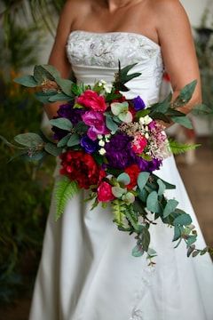 Jewel Tone Rainbow Peony Wedding Bouquets Custom Purple Red - Etsy Bright Cascade Wedding Bouquet, Jewel Tone Wedding Flowers Bouquets, Jewel Tone Wedding Decor Table Settings, Jewel Tone Flowers Wedding, Jewel Tone Wedding Centerpieces, Fuschia Wedding Flowers, Jewel Tone Wedding Bouquet, Gem Tone Wedding, Fall Jewel Tone Wedding